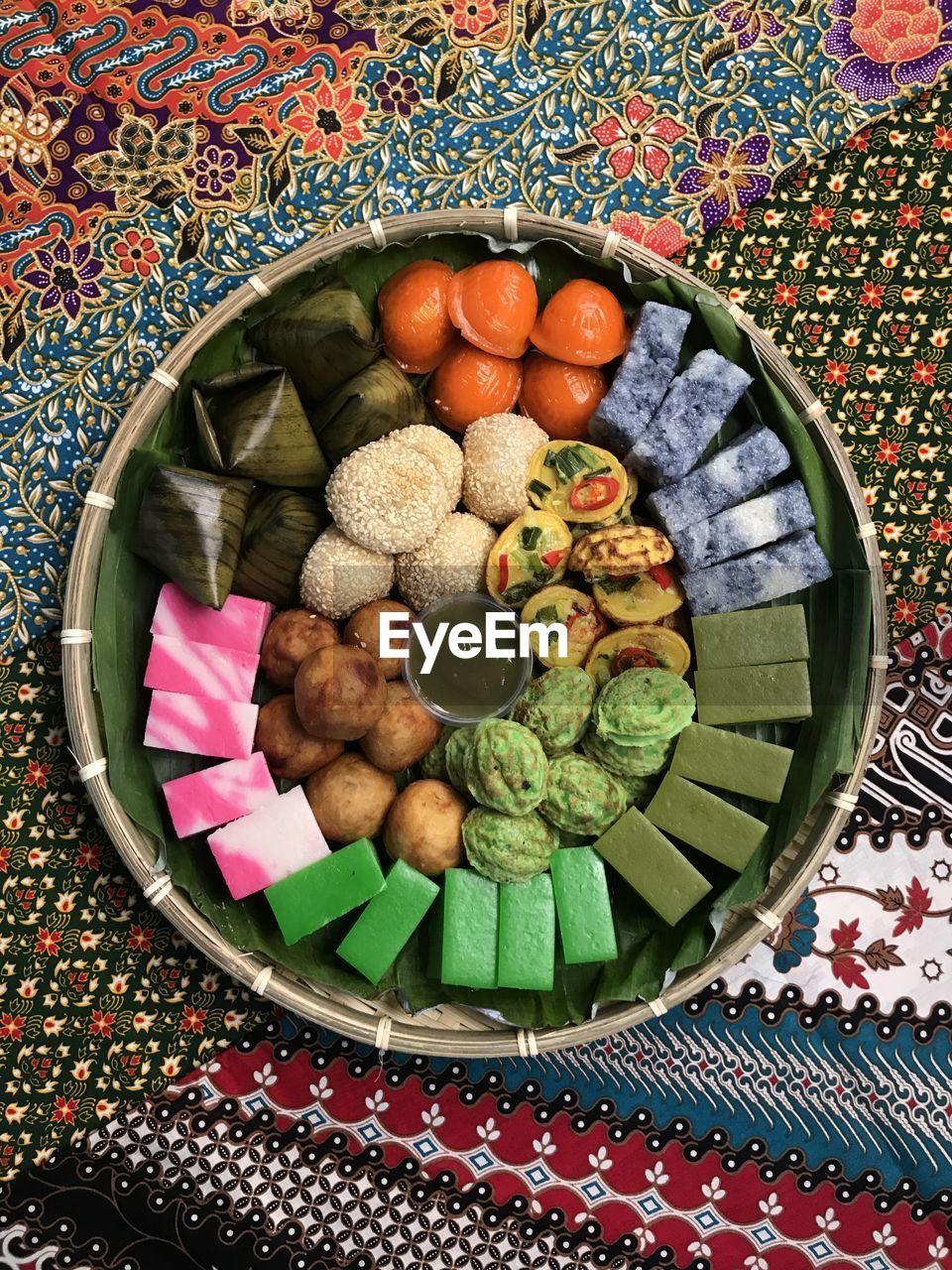 High angle view of kuih in a basket on table