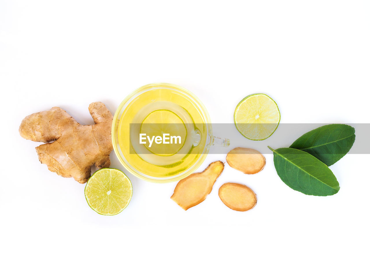 HIGH ANGLE VIEW OF LEMON AND LEAVES ON WHITE BACKGROUND