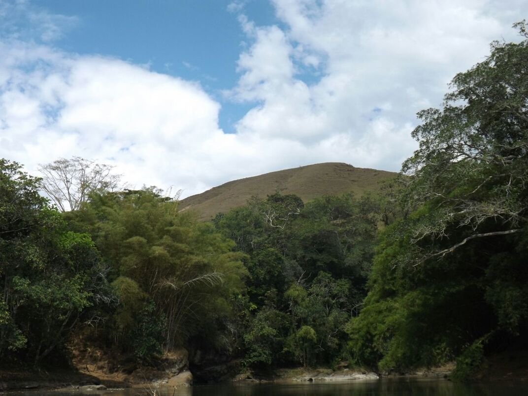 SCENIC VIEW OF MOUNTAINS AGAINST CLOUDY SKY