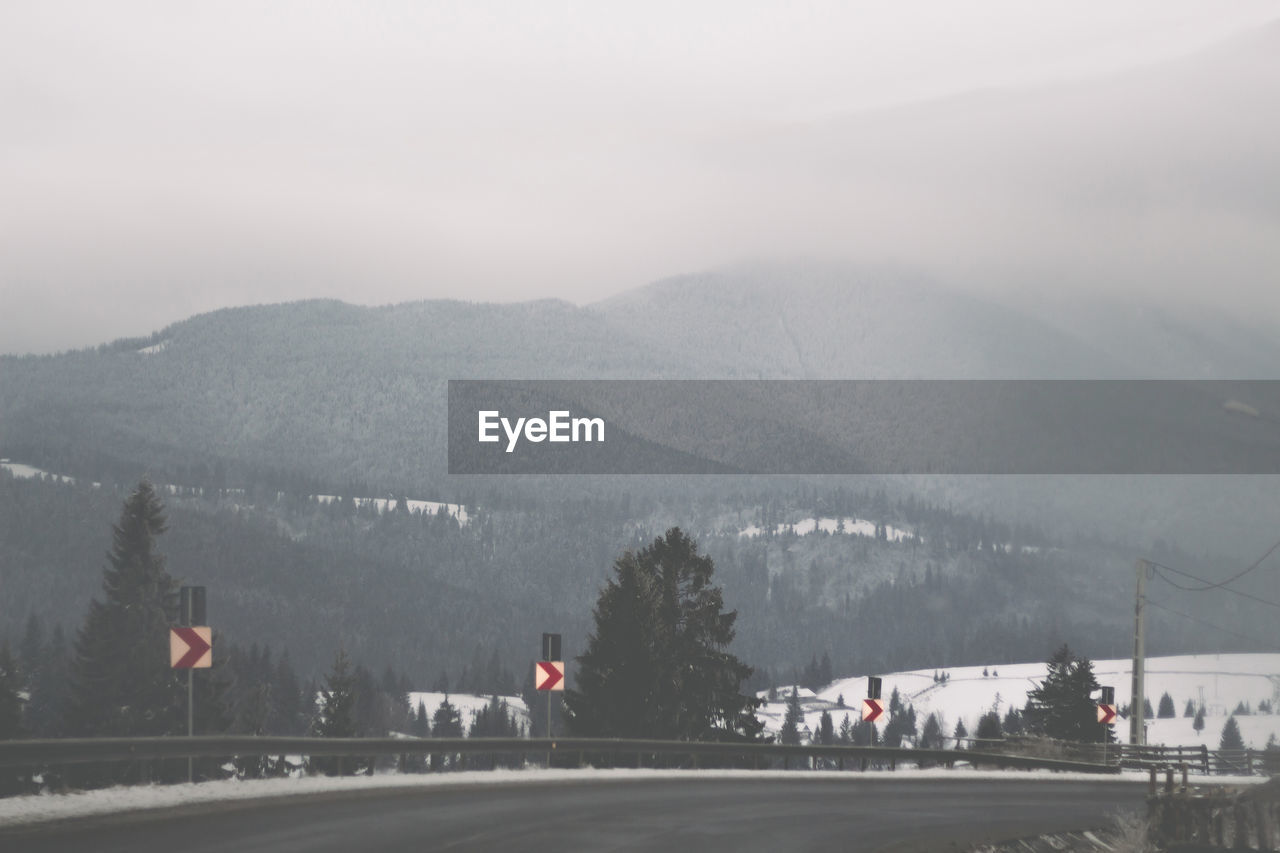 Scenic view of mountains against sky during winter