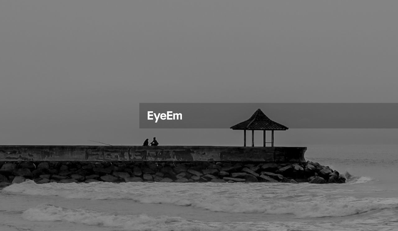 GAZEBO ON BEACH AGAINST CLEAR SKY