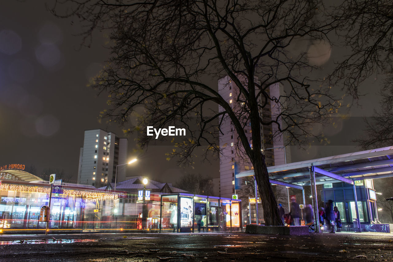 VIEW OF ILLUMINATED CITY AT NIGHT