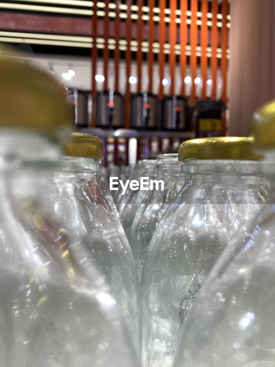 CLOSE-UP OF GLASS BOTTLES
