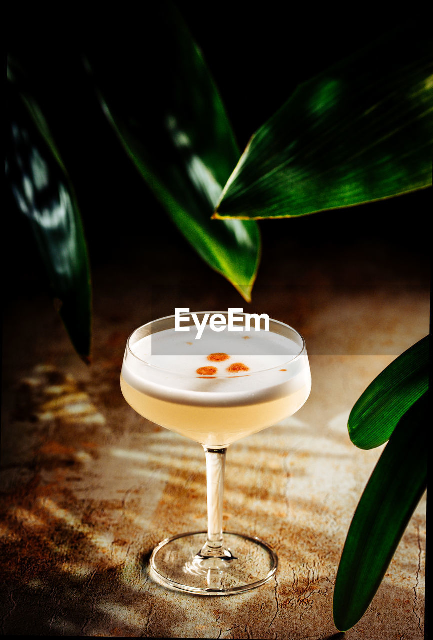 Pisco sour - peruvian and chilean cocktail classic in tropical setting