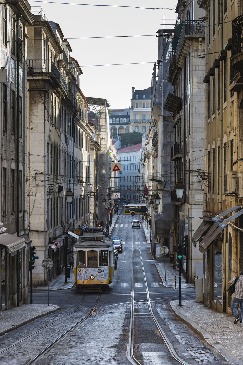 Street amidst buildings in city against sky