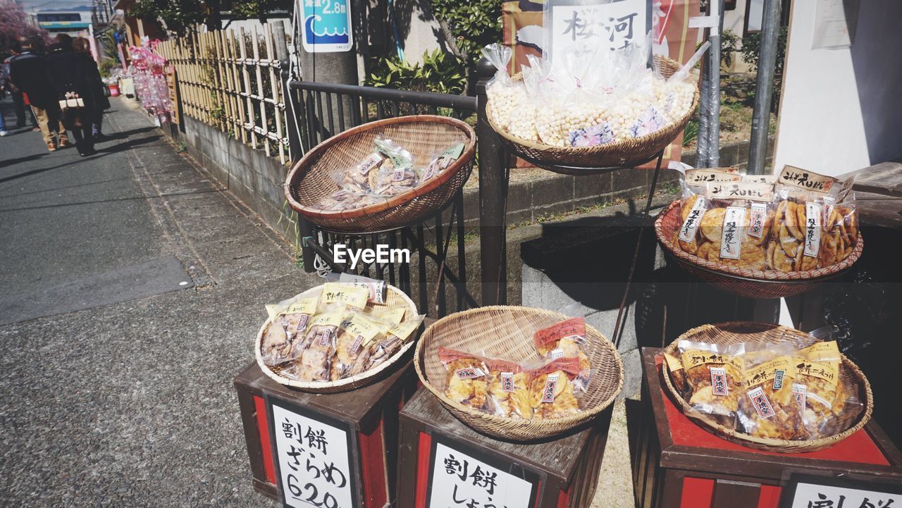 Street food in wicker baskets for sale at street market