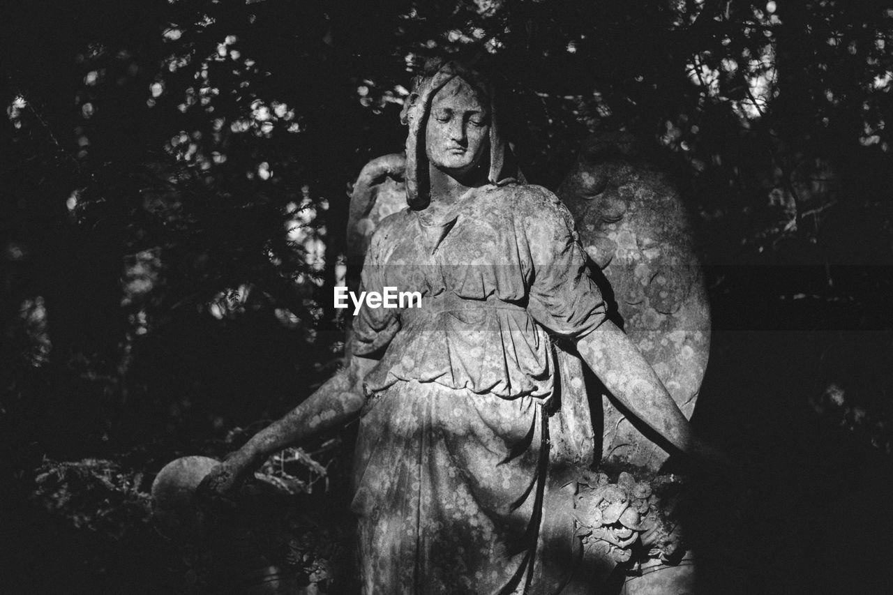 Old angel statue in cemetery