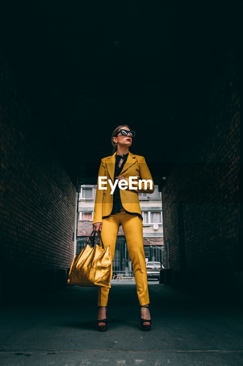 Businesswoman standing on road