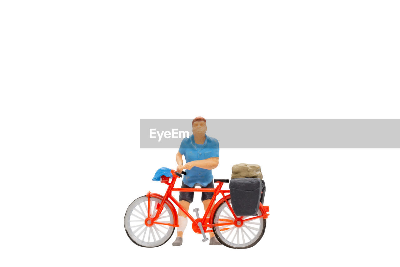 transportation, copy space, bicycle, adult, white background, medical equipment, vehicle, men, cut out, one person, full length, wheelchair, studio shot, person, sitting, sports, mode of transportation, casual clothing, lifestyles, cycling, emotion, motion, happiness, smiling, activity, riding, senior adult, differing abilities, indoors, land vehicle, healthcare and medicine