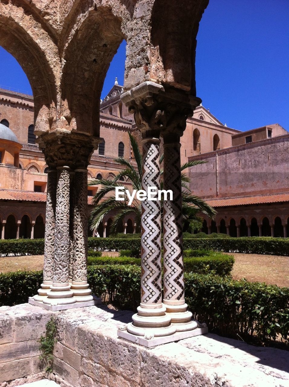 Columns against park and building