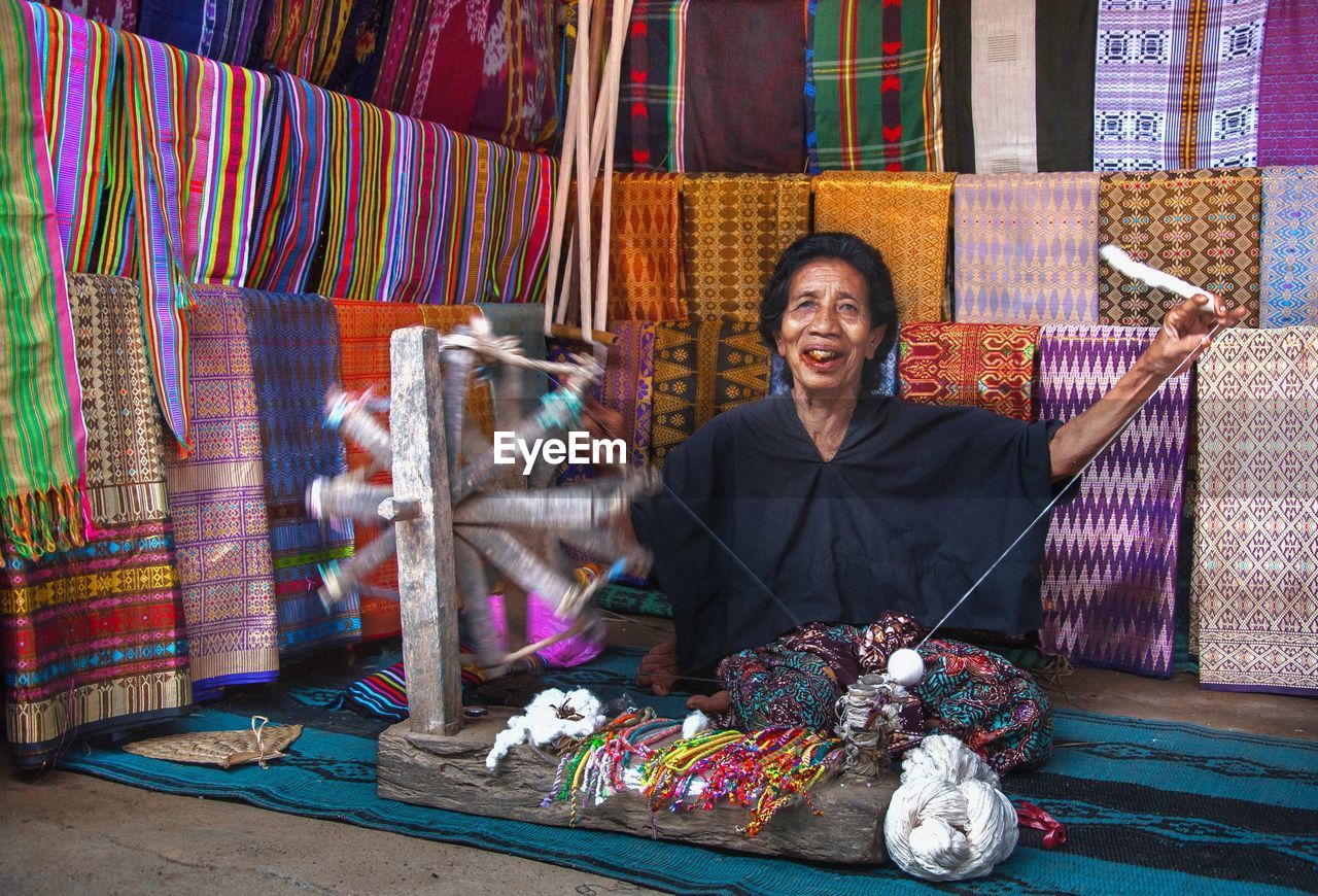 Portrait of smiling woman working in workshop