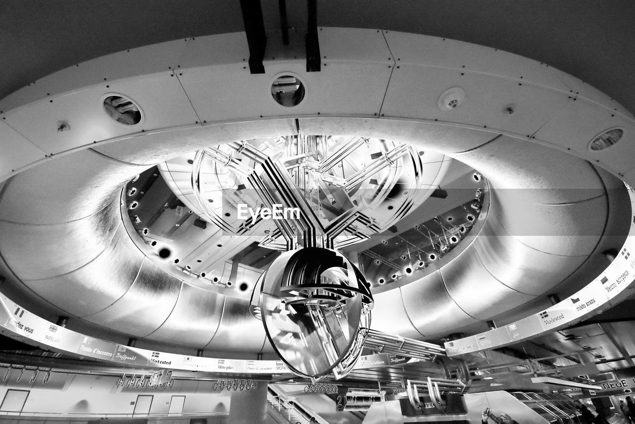 LOW ANGLE VIEW OF SPIRAL STAIRCASE IN CEILING