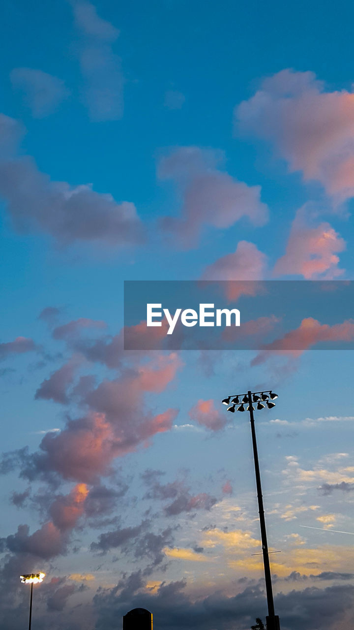 LOW ANGLE VIEW OF COMMUNICATIONS TOWER AGAINST SKY