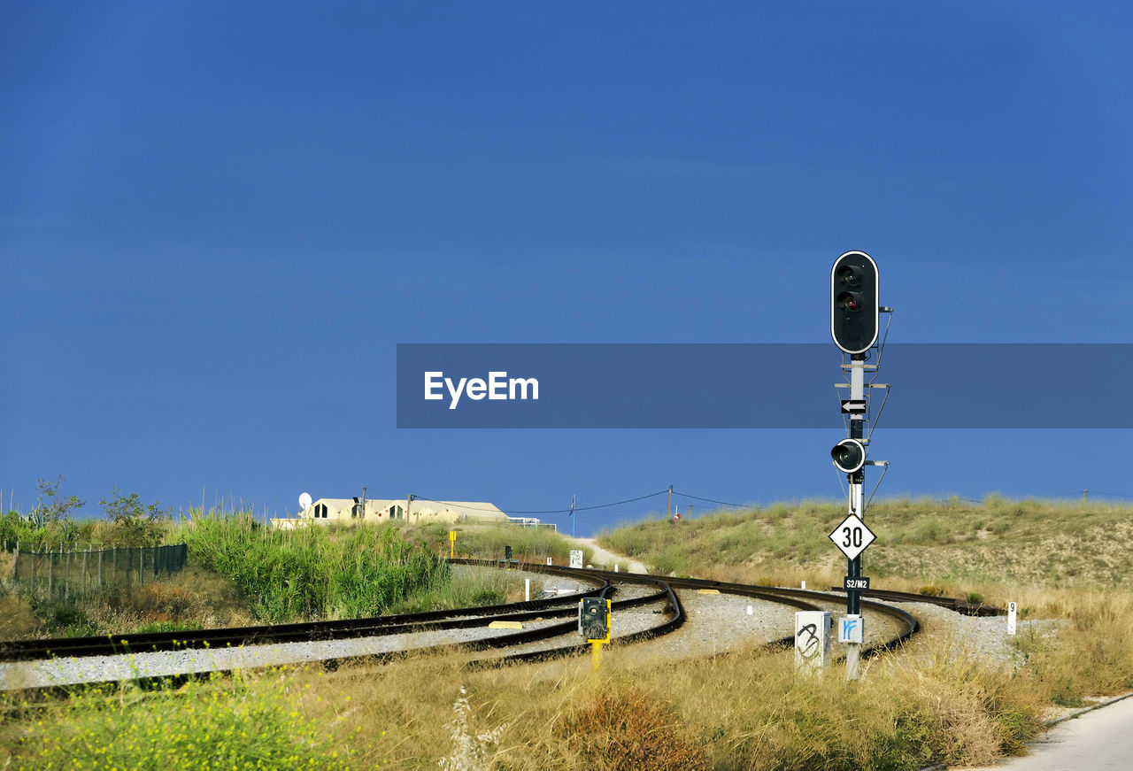 Railway tracks along countryside landscape