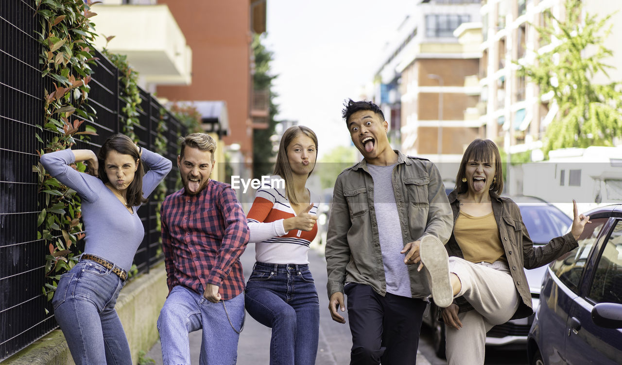 PEOPLE STANDING OUTDOORS