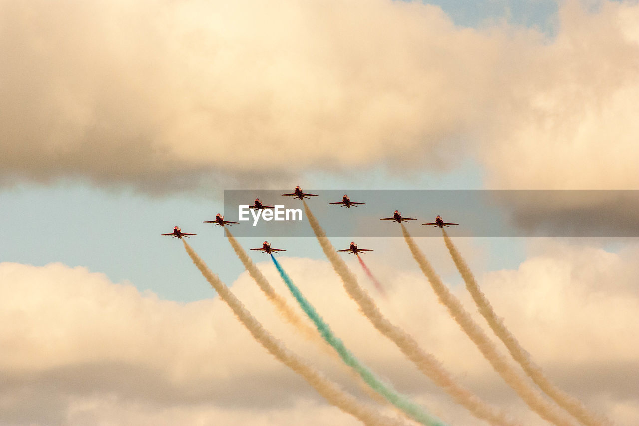 LOW ANGLE VIEW OF AIRPLANES FLYING AGAINST SKY