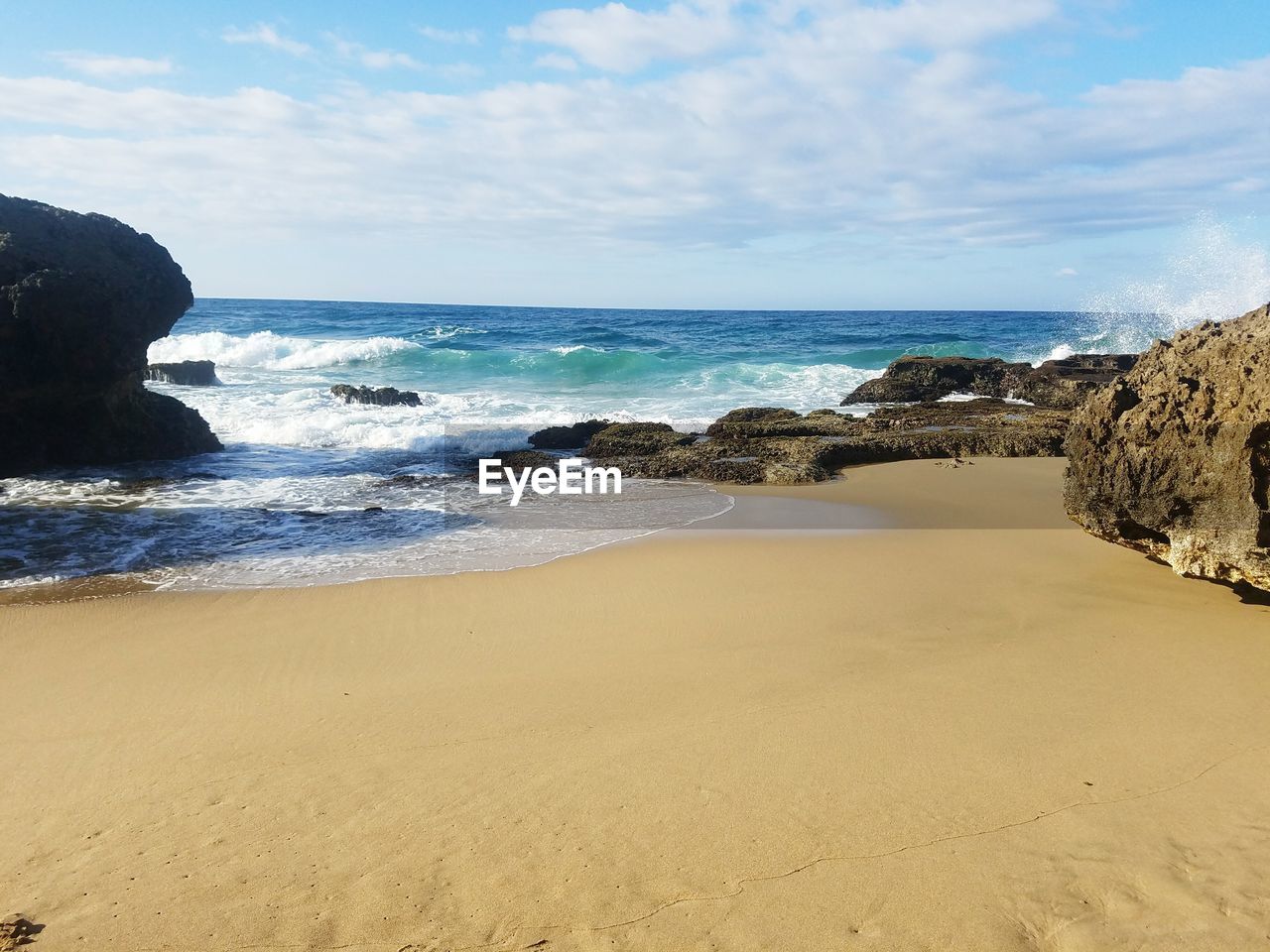 Scenic view of beach against sky