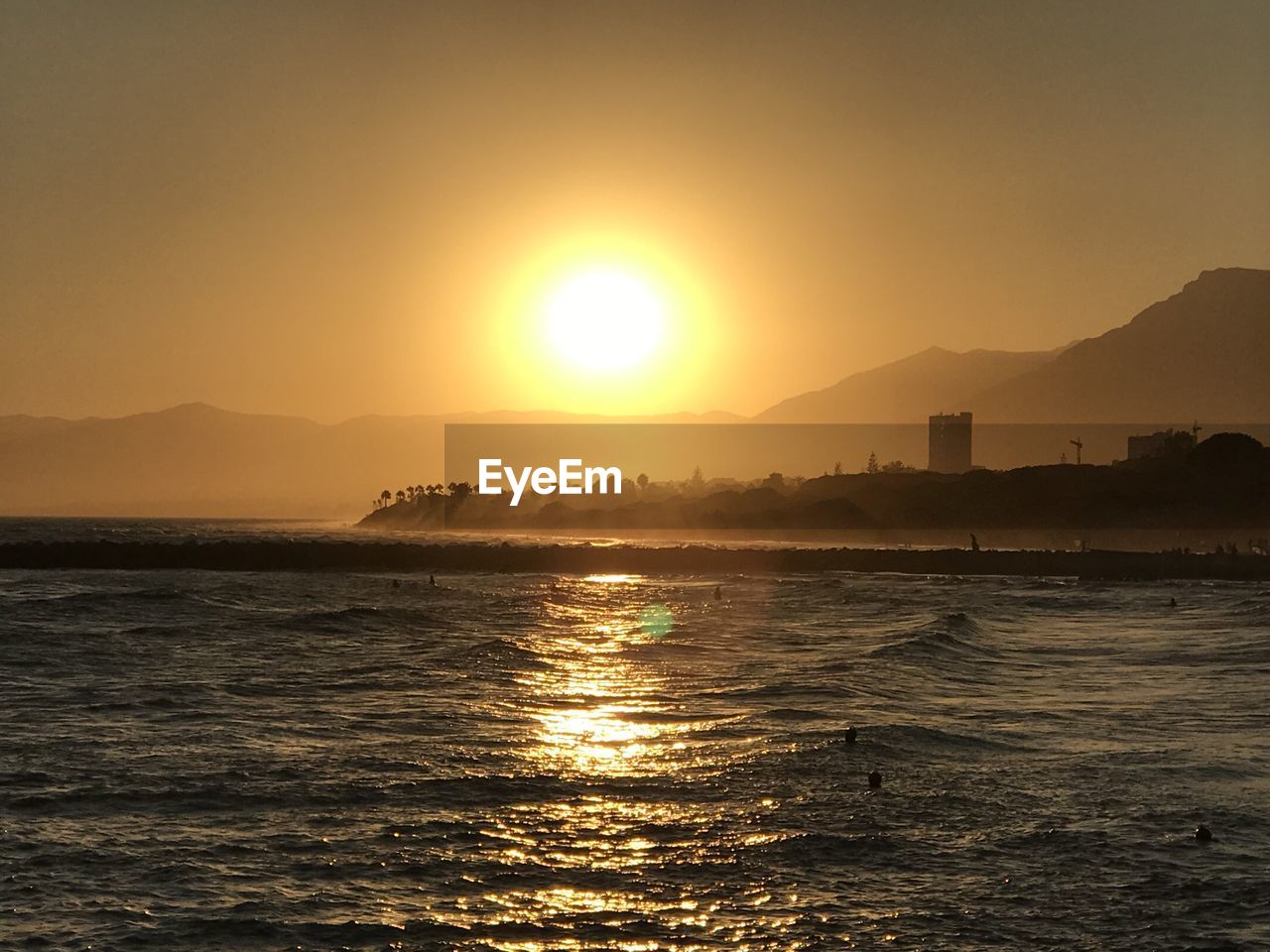 Scenic view of sea against sky during sunset