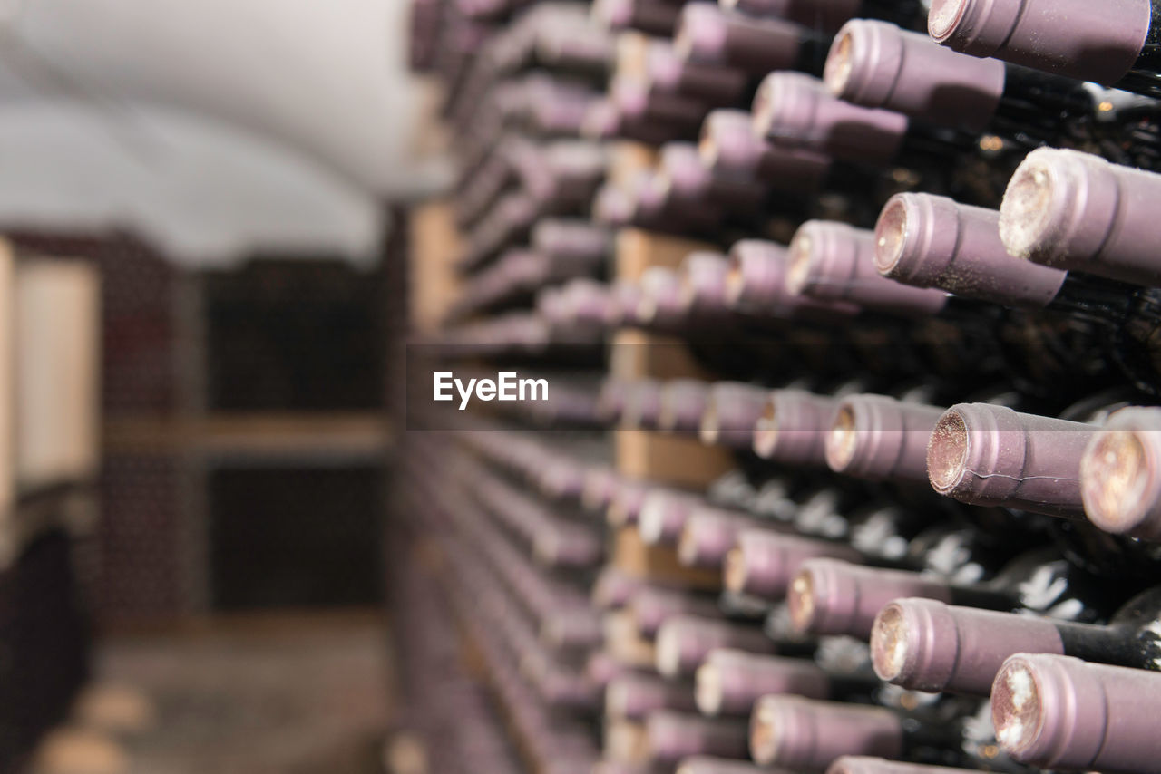 Wine bottles on rack in storage compartment