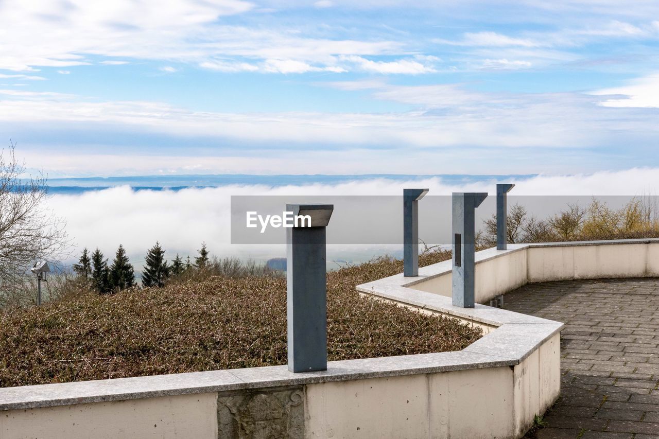 View of railing against cloudscape