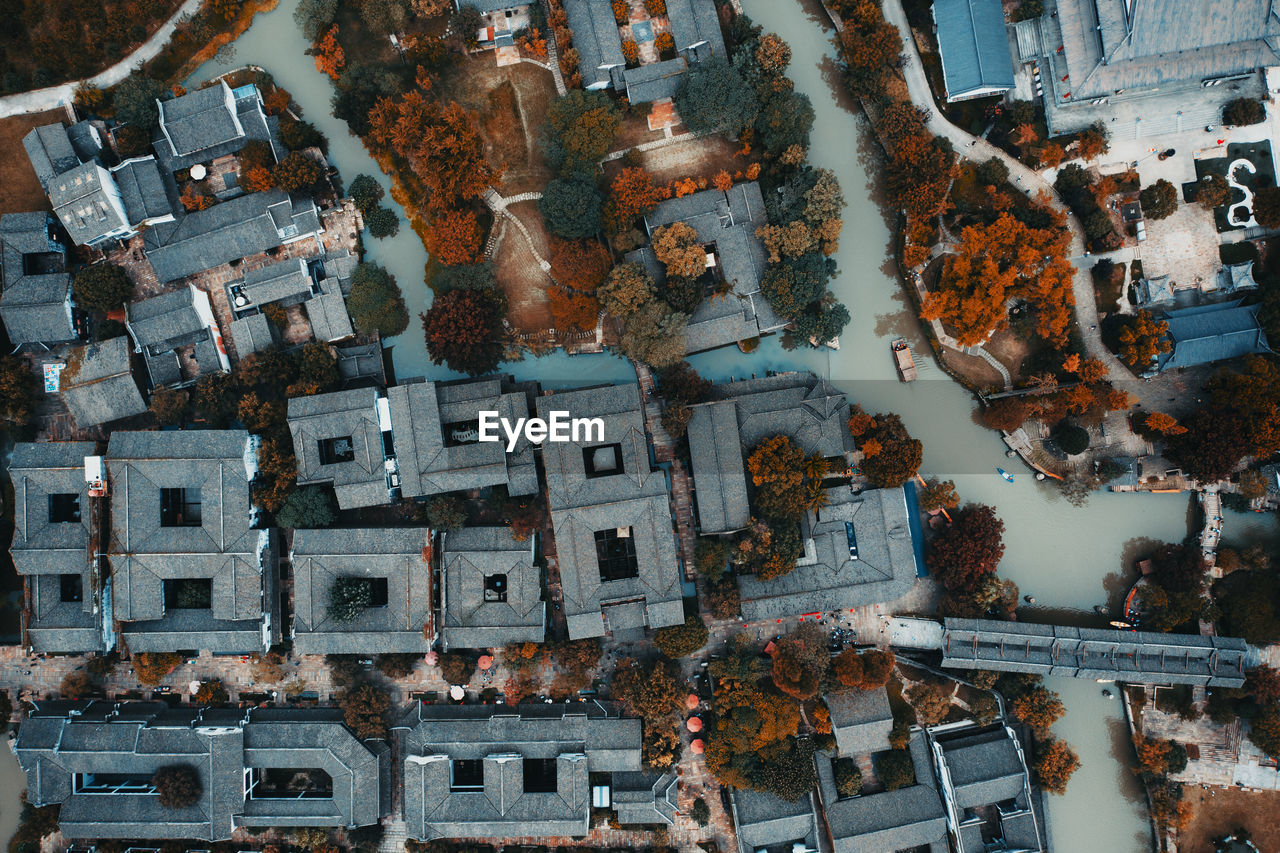 HIGH ANGLE VIEW OF ILLUMINATED BUILDINGS IN CITY