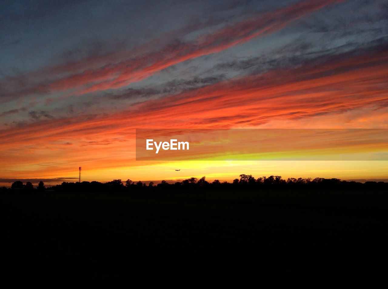 SILHOUETTE OF LANDSCAPE AT SUNSET