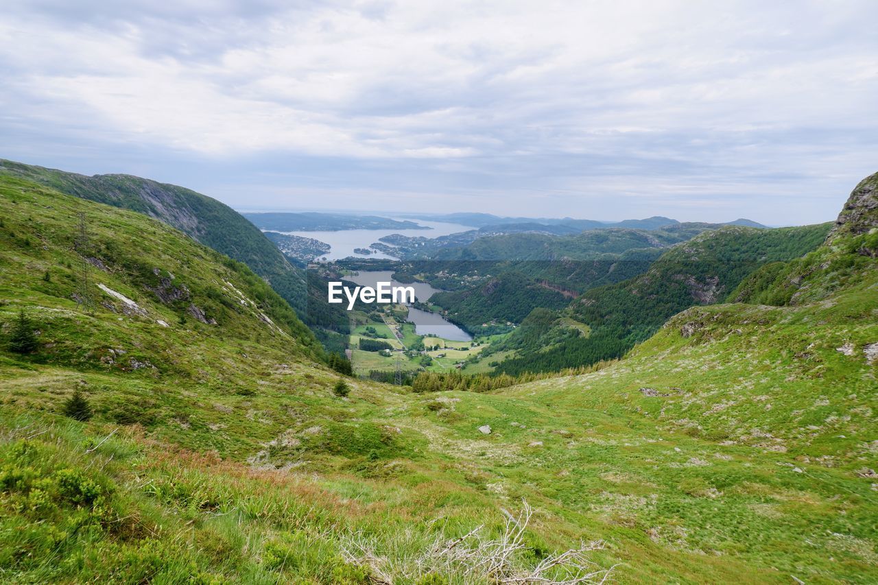 SCENIC VIEW OF VALLEY AGAINST SKY