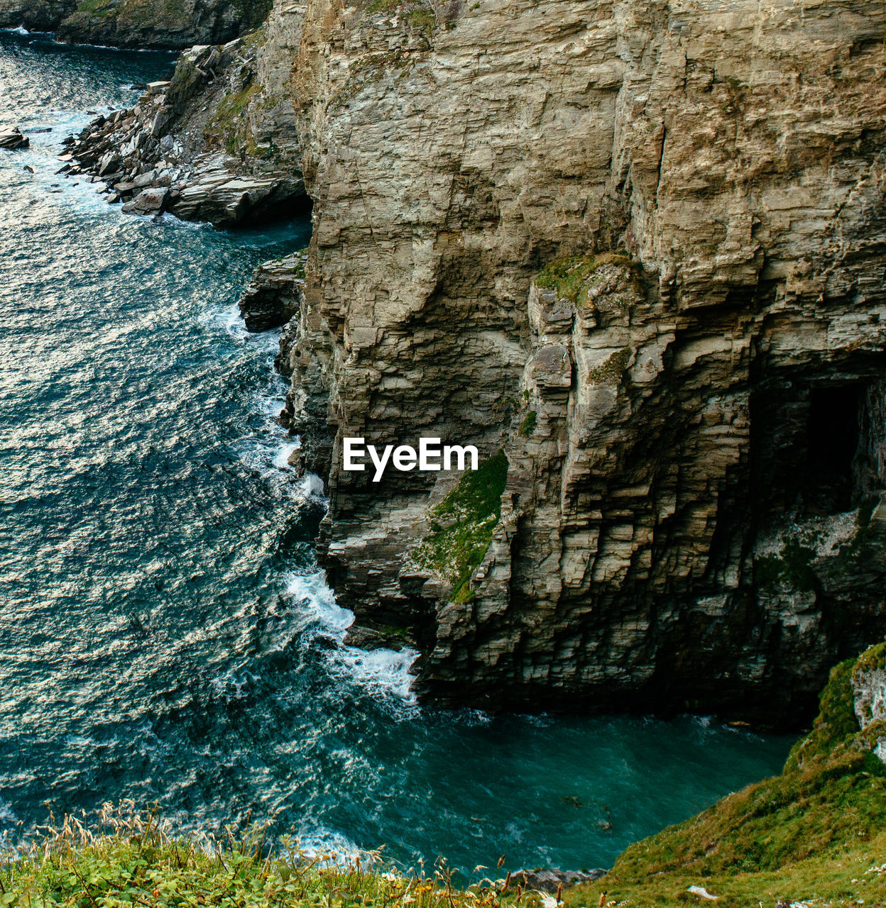 High angle view of rock formations by sea
