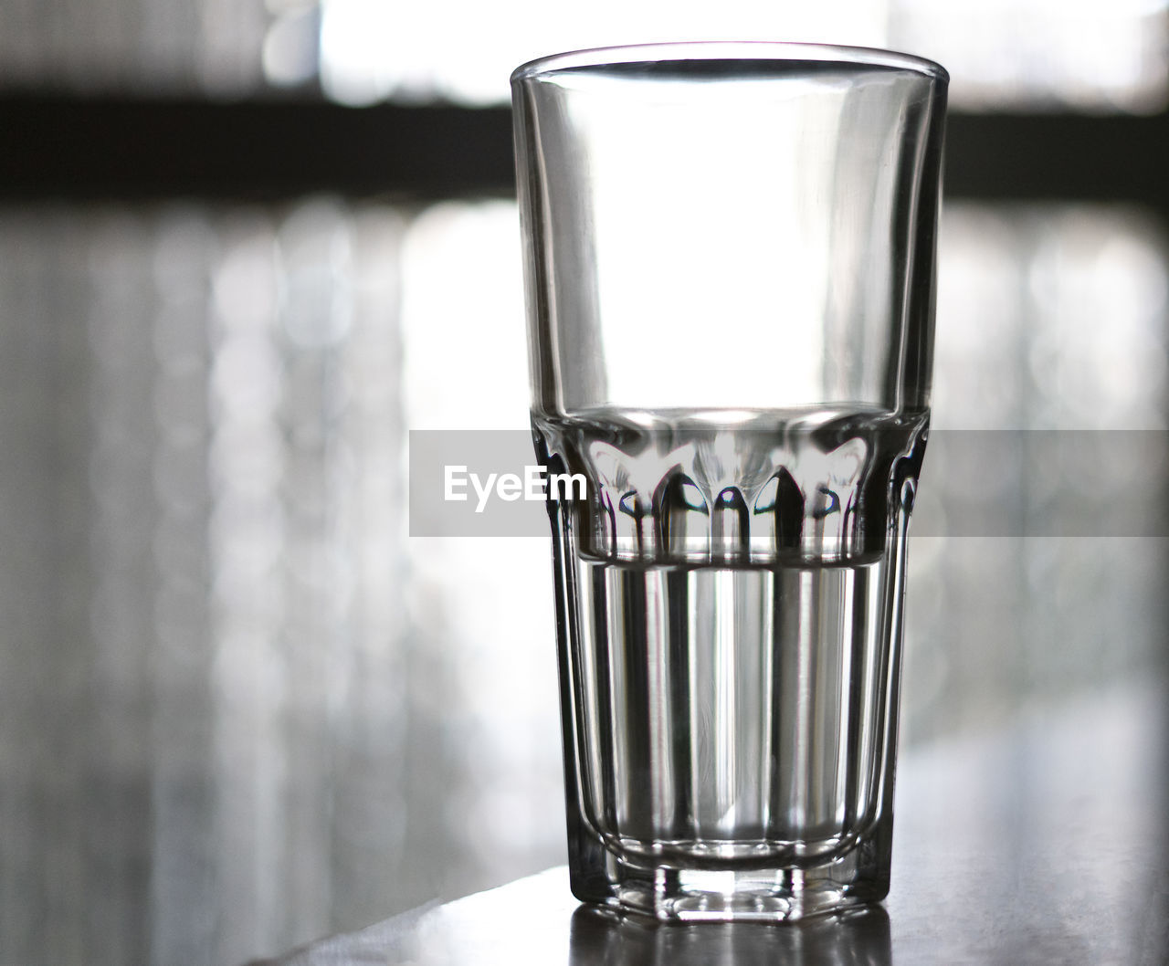 Glass of water on a white background.