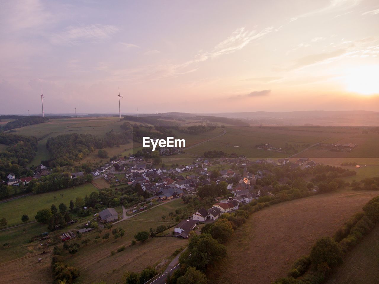 Aerial view of landscape against sky during sunset