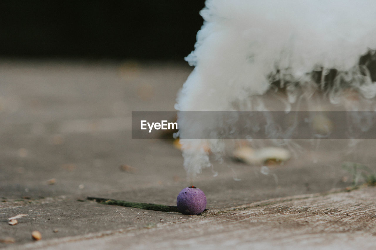 Smoke emitting through cracker on street