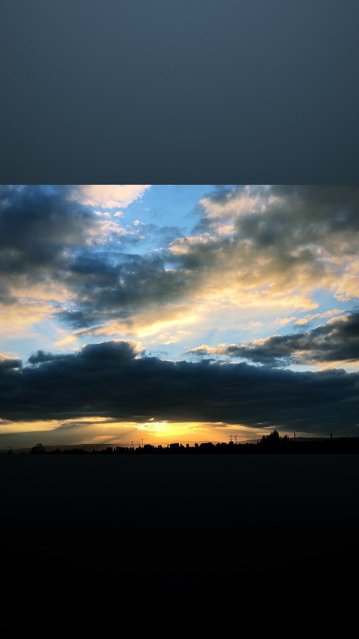 SCENIC VIEW OF SILHOUETTE LANDSCAPE AGAINST DRAMATIC SKY DURING SUNSET