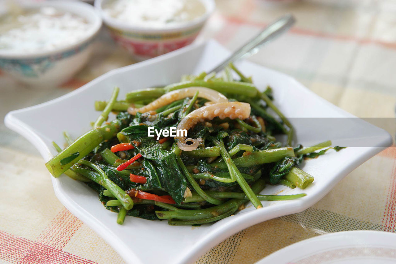 Sambal kangkong served in plate on table