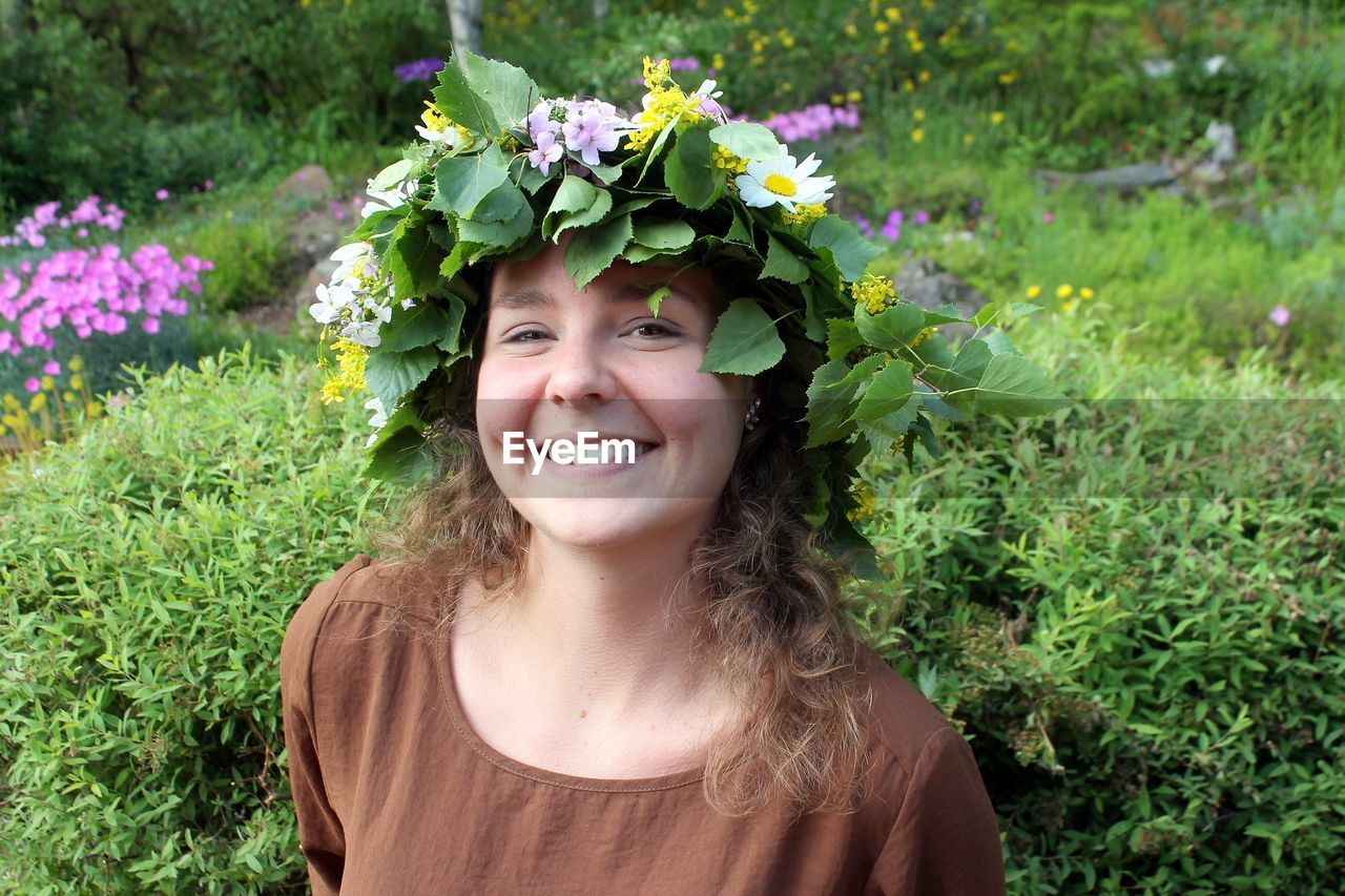 Portrait of smiling woman wearing flower headwear