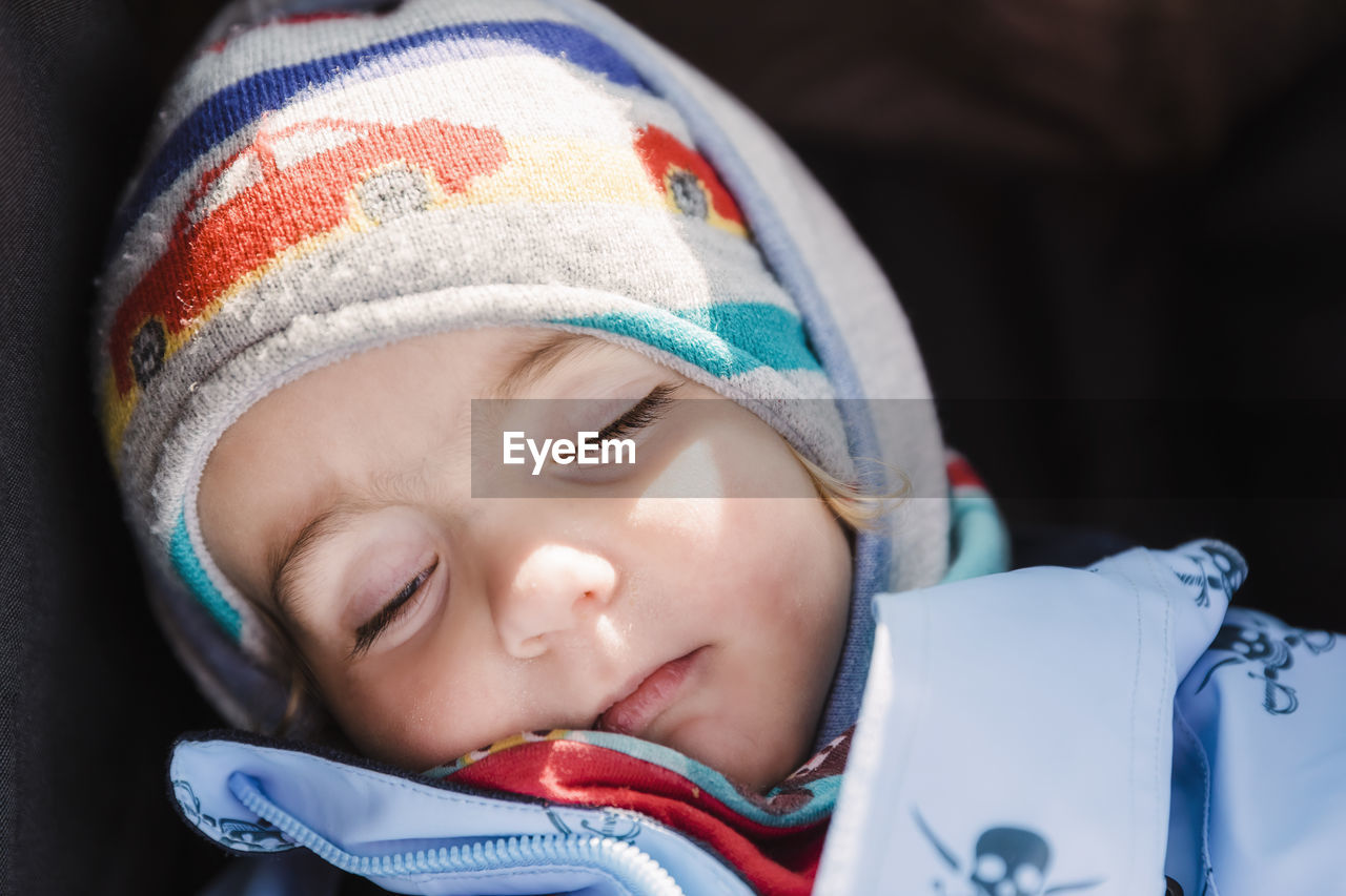 Close-up of girl sleeping at home