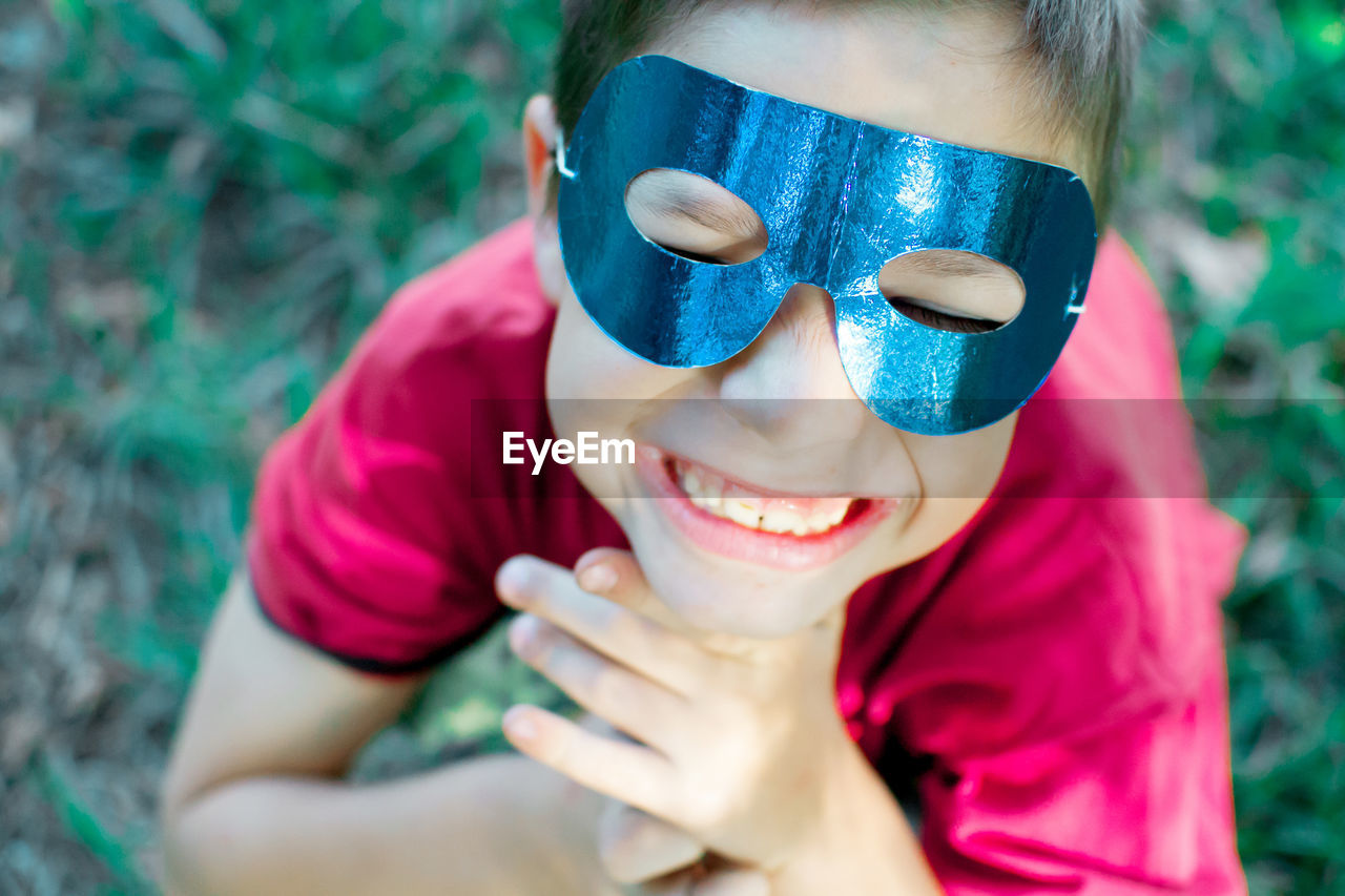 Close-up of smiling boy wearing mask