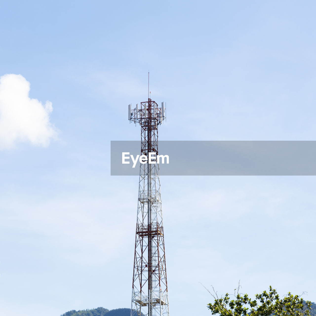 Low angle view of communications tower against sky