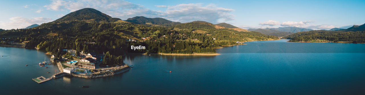 Panoramic view of bay against sky