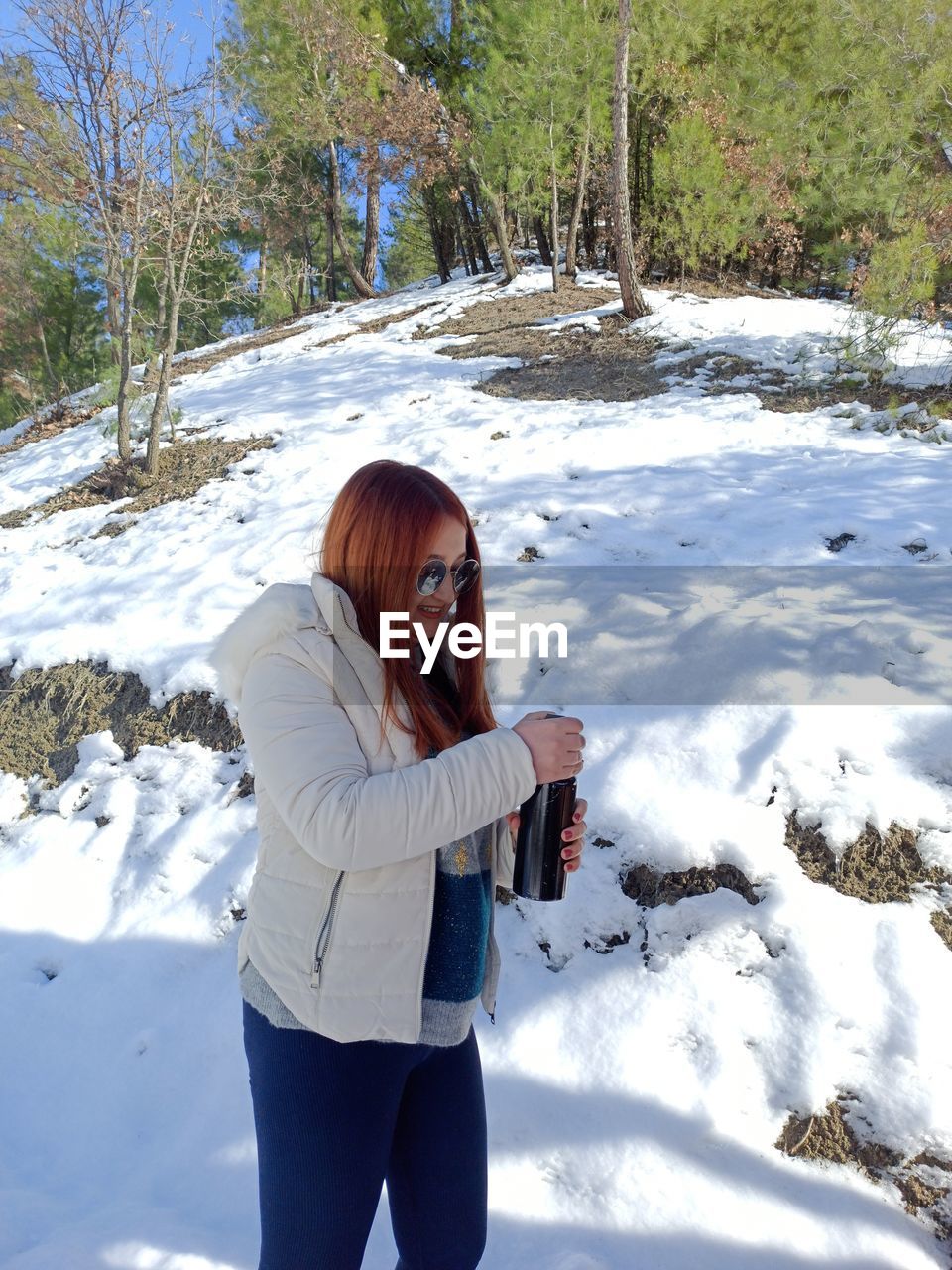 Rear view of woman standing in water