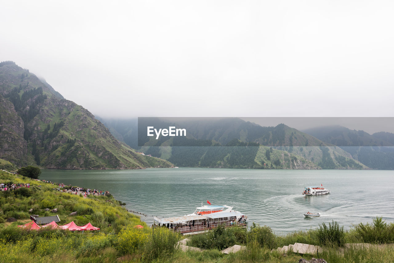 Scenic view of boats in lake