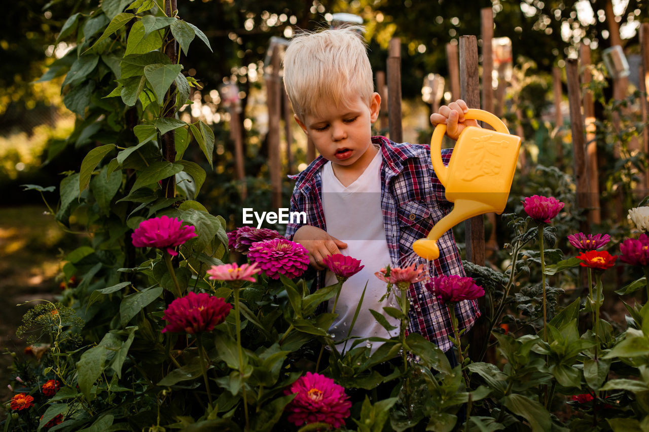 Full length of cute baby flowering plants