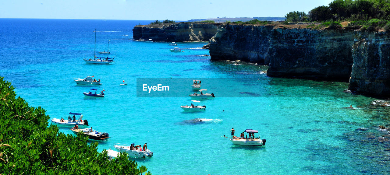 High angle view of people traveling on boats in sea