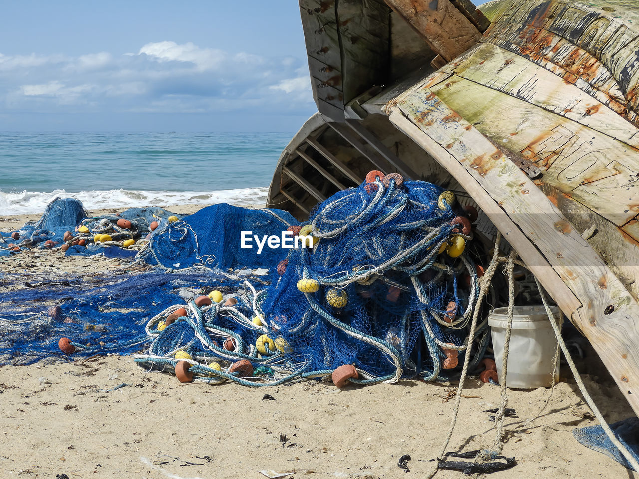 Fishing boat and fish net in ada foah ghana. after night work on sea.