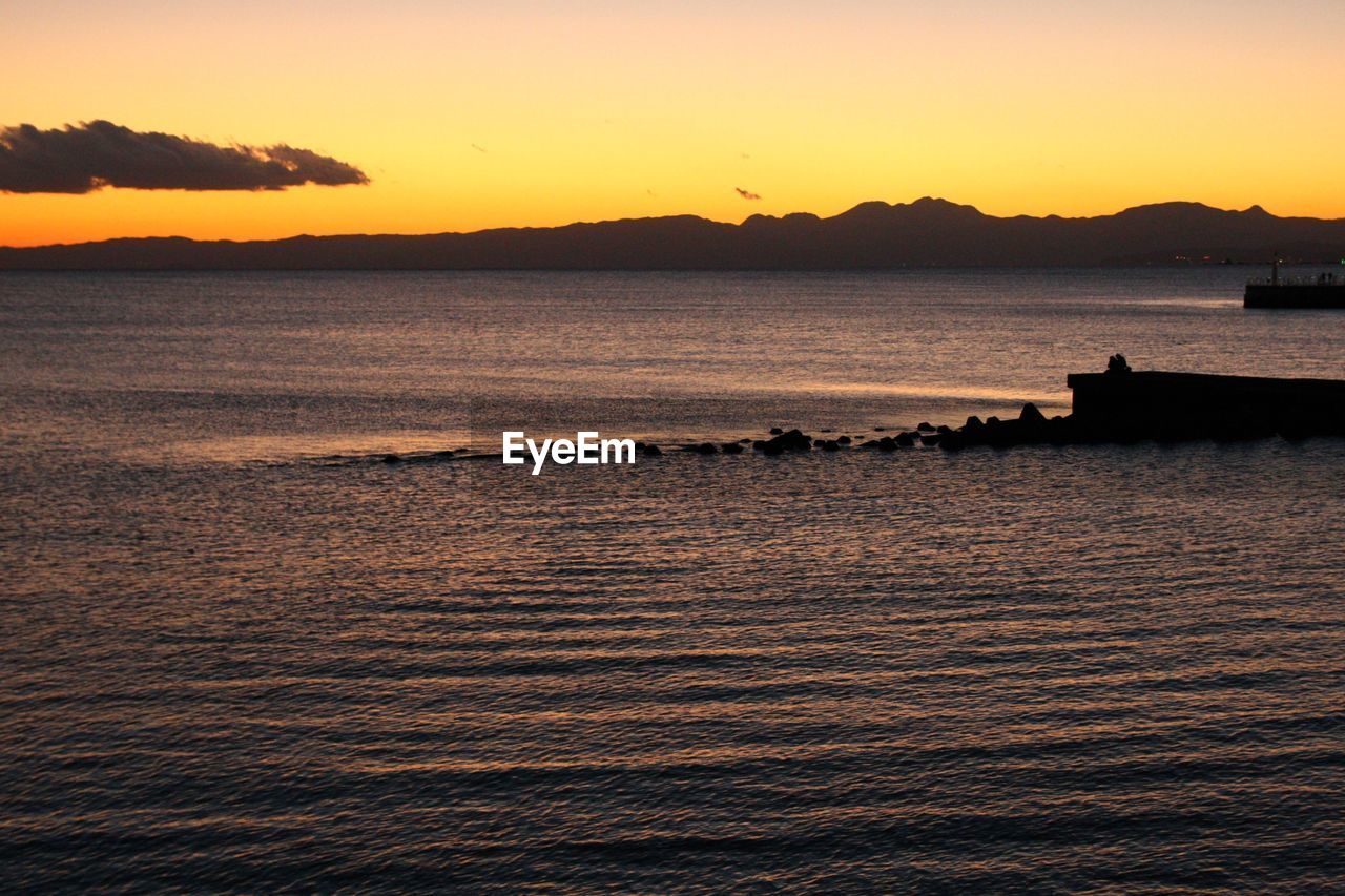 Scenic view of sea at sunset