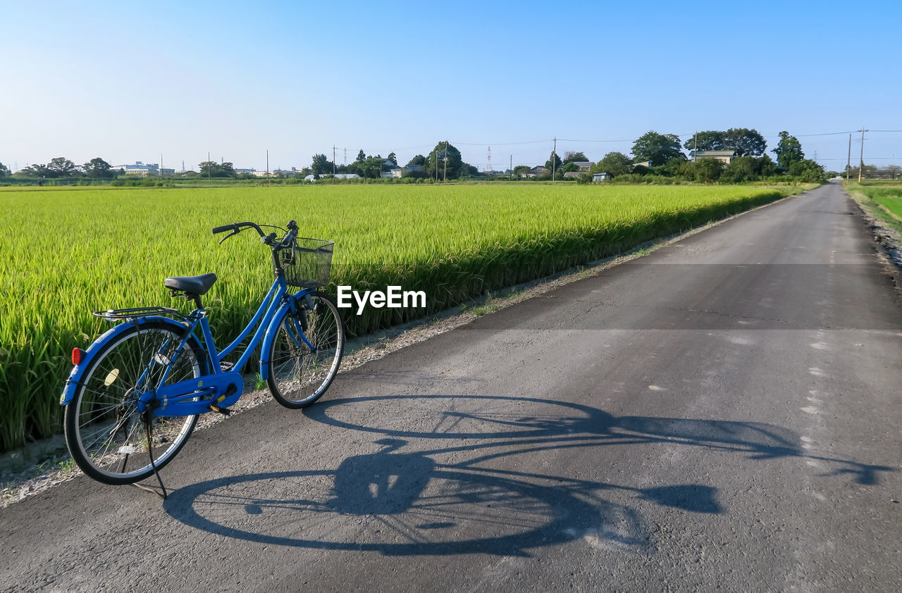 BICYCLE PARKED ON ROAD