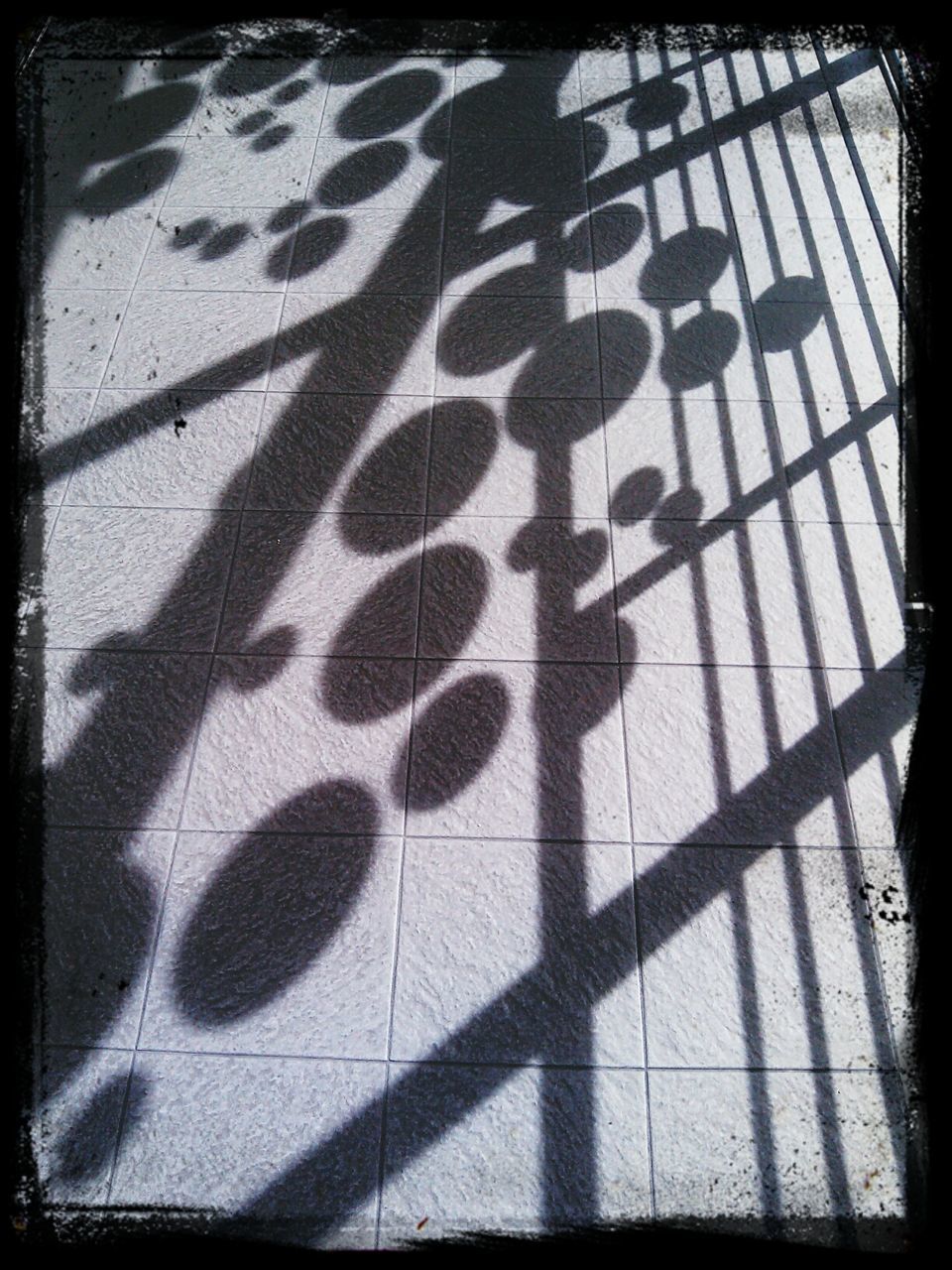 Shadow on railing