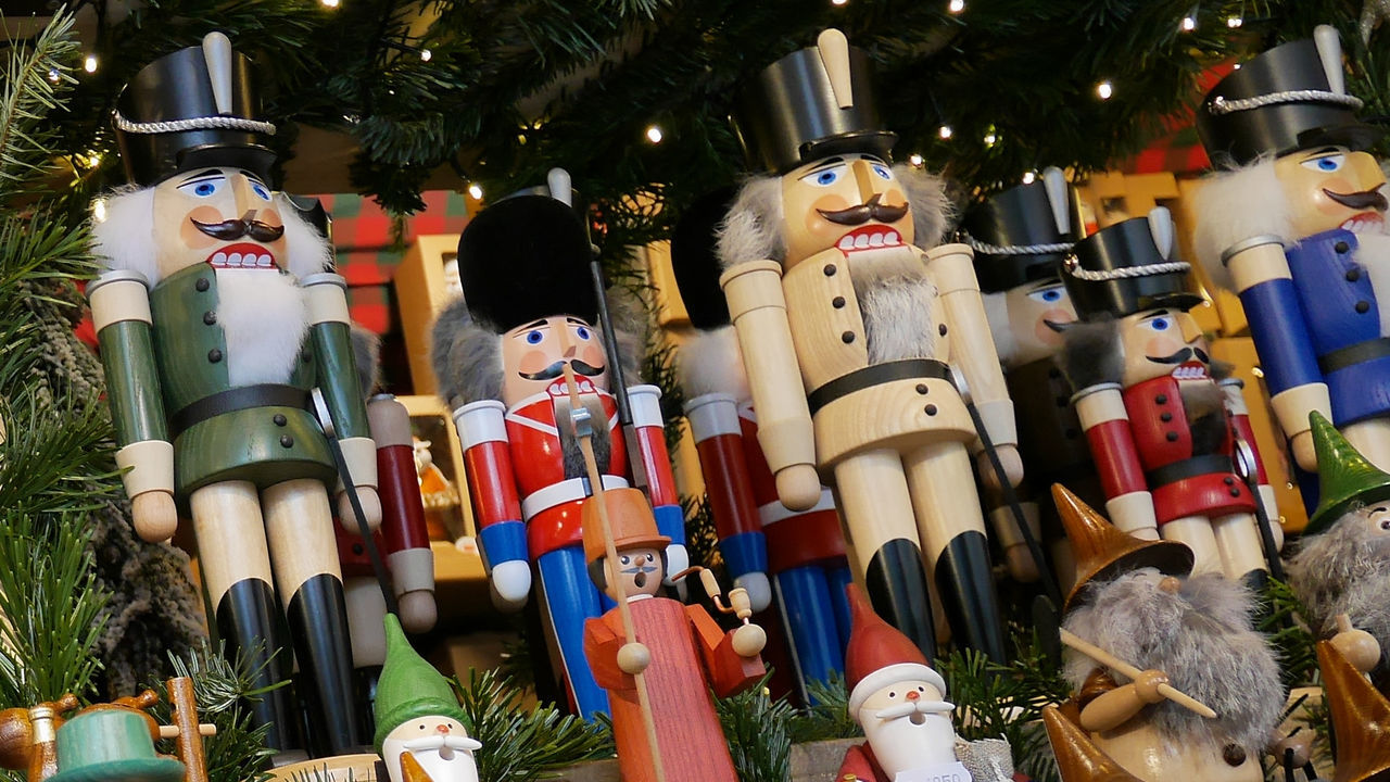 Low angle view of figurines hanging in marker for sale