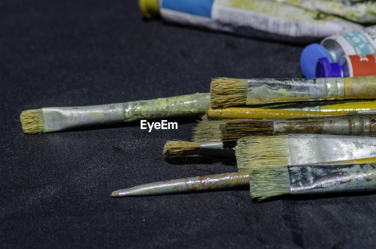 High angle view of paintbrushes on table