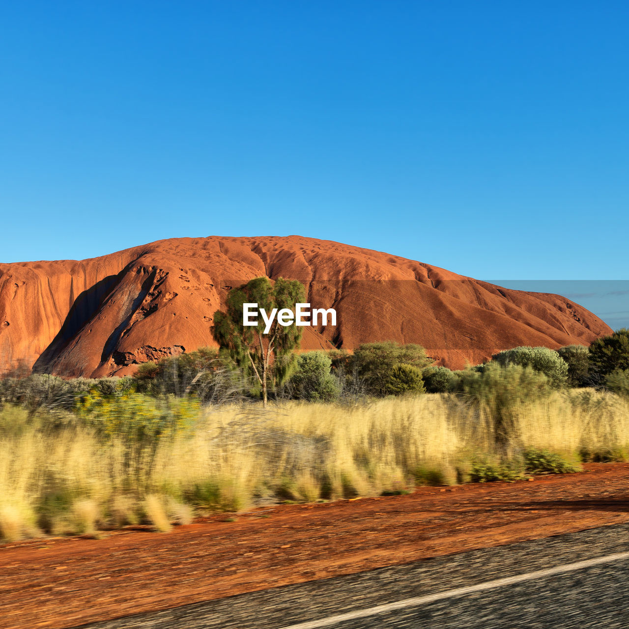 SCENIC VIEW OF LAND AGAINST CLEAR BLUE SKY