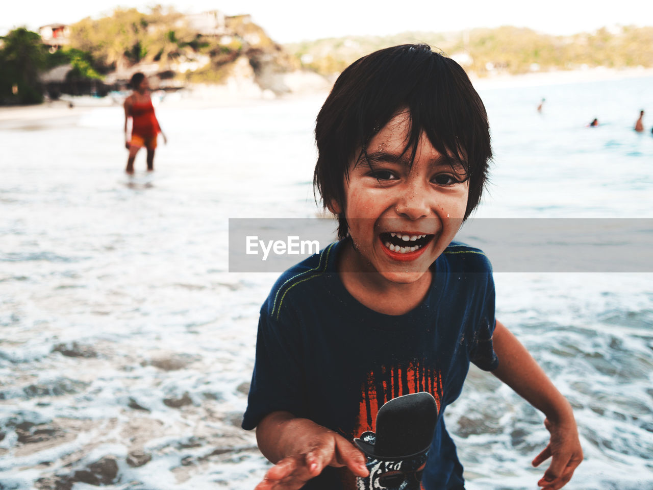 Portrait of happy boy at beach
